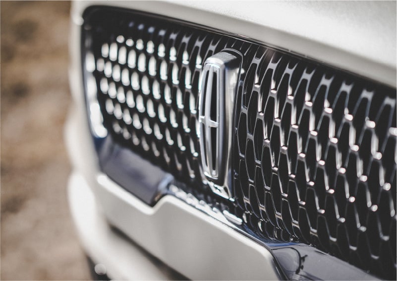 The grille of the 2023 Lincoln Aviator® Reserve model with an eye-catching repeated field of Lincoln Star logo shapes | Oliver Lincoln in Plymouth IN
