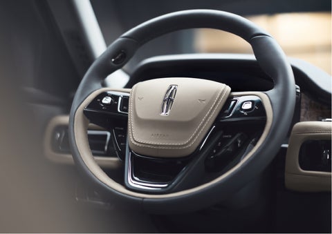 The intuitively placed controls of the steering wheel on a 2023 Lincoln Aviator® SUV | Oliver Lincoln in Plymouth IN