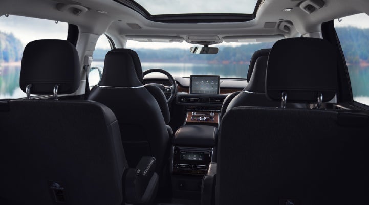 The interior of a 2024 Lincoln Aviator® SUV from behind the second row | Oliver Lincoln in Plymouth IN