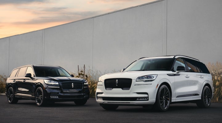 Two Lincoln Aviator® SUVs are shown with the available Jet Appearance Package | Oliver Lincoln in Plymouth IN