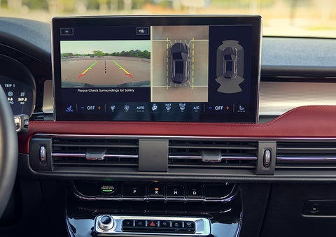The driver of a 2024 Lincoln Corsair® SUV is shown selecting the drive mode. | Oliver Lincoln in Plymouth IN