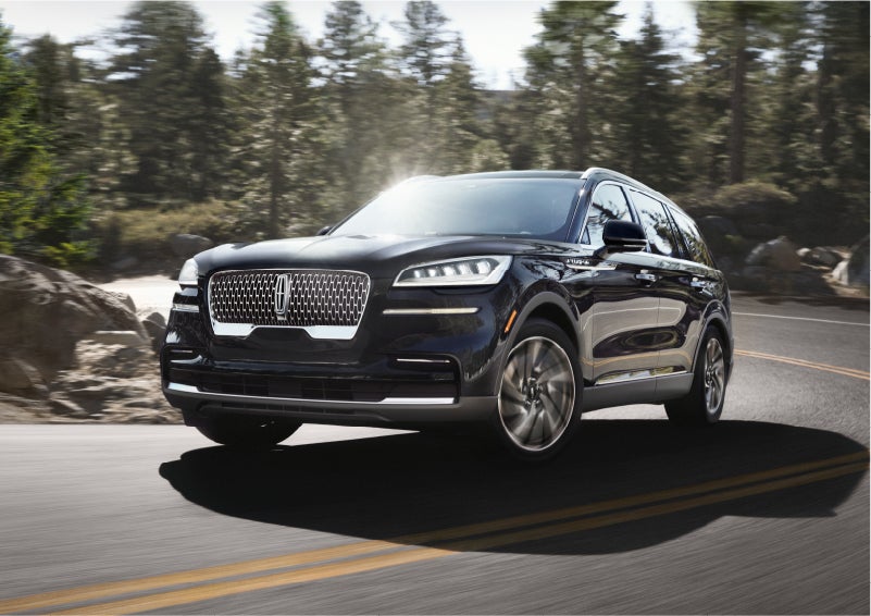 A Lincoln Aviator® SUV is being driven on a winding mountain road | Oliver Lincoln in Plymouth IN