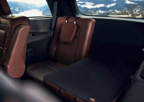 The left rear seat of a 2024 Lincoln Aviator® SUV is shown folded flat for additional cargo space | Oliver Lincoln in Plymouth IN